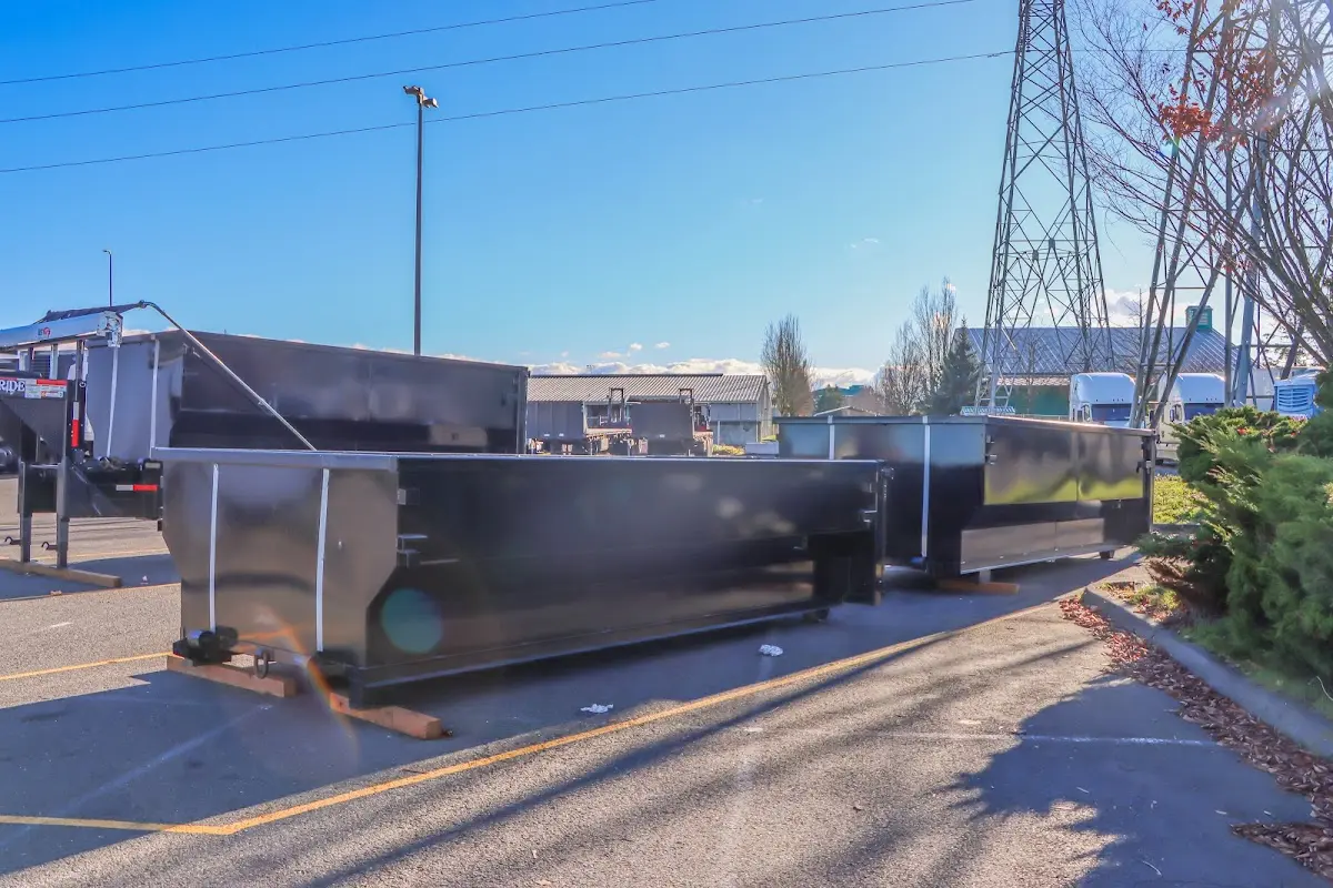 Roll-off dumpster ready for waste disposal at job site for 12 Yard Dumpster Rental in Fairburn